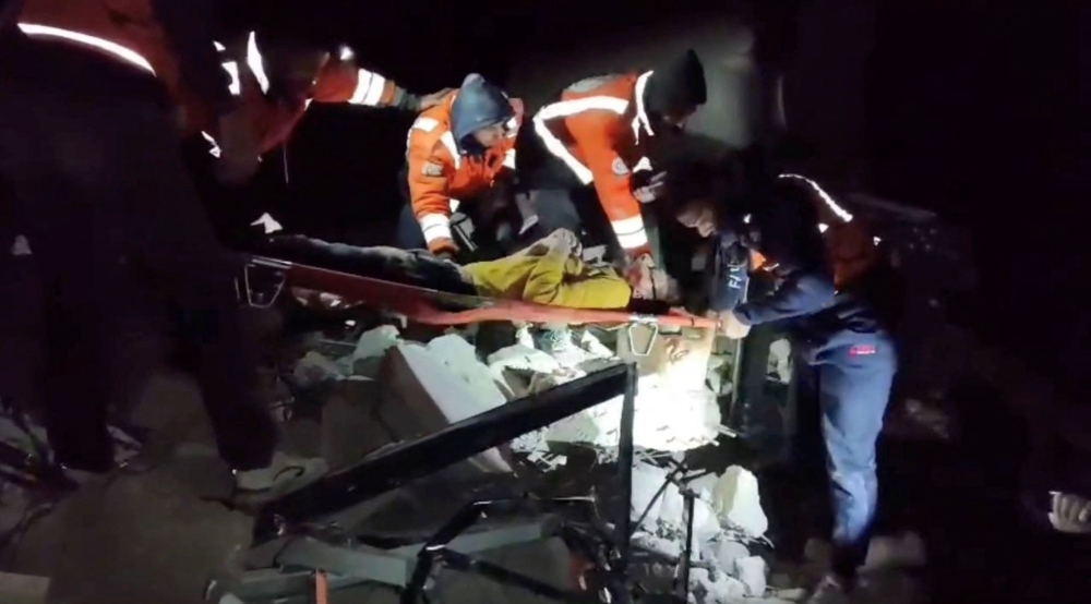 A casualty is transported after being rescued by emergency personnel, amid the ongoing conflict between Israel and the Palestinian Islamist group Hamas, in Gaza City, in this screengrab from a video released on March 16, 2024.  — Palestinian Civil Defence handout via Reuters
