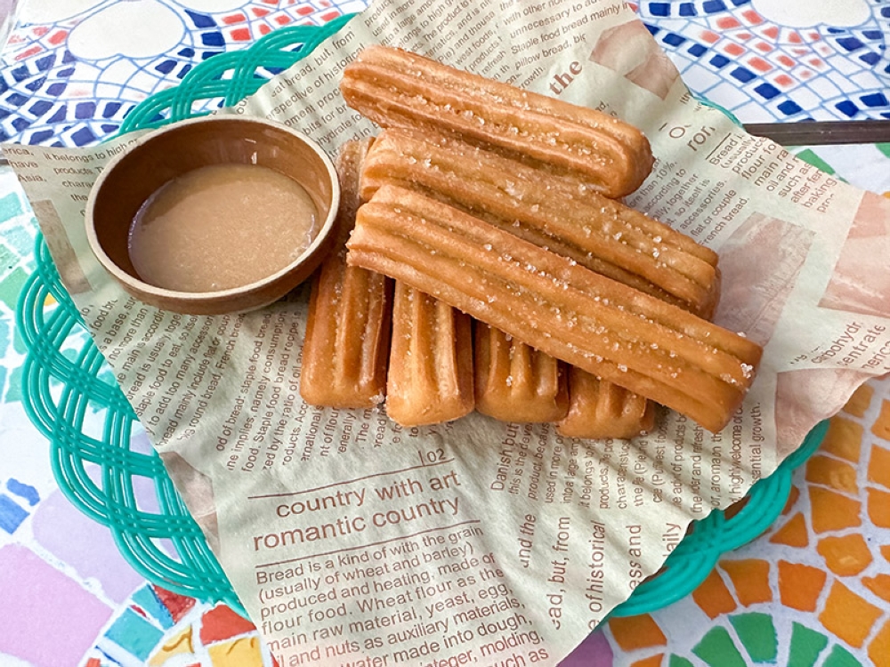 Churros de Cajeta is crunchier with a firmer texture which one pairs with the 'dulce de leche'
