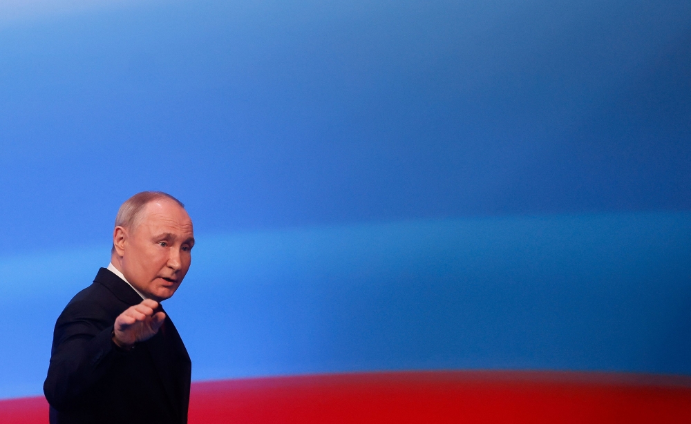 President Vladimir Putin won a record post-Soviet landslide in Russia’s election yesterday, cementing his already tight grip on power in a victory he said showed Moscow had been right to stand up to the West and send its troops into Ukraine. — Reuters pic
