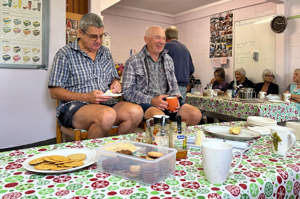 This photo taken on February 27, 2024 shows members of the Hastings Coffin Club having morning tea and chatting on their work day at the Coffin Club workshop in Hastings. — AFP pic
