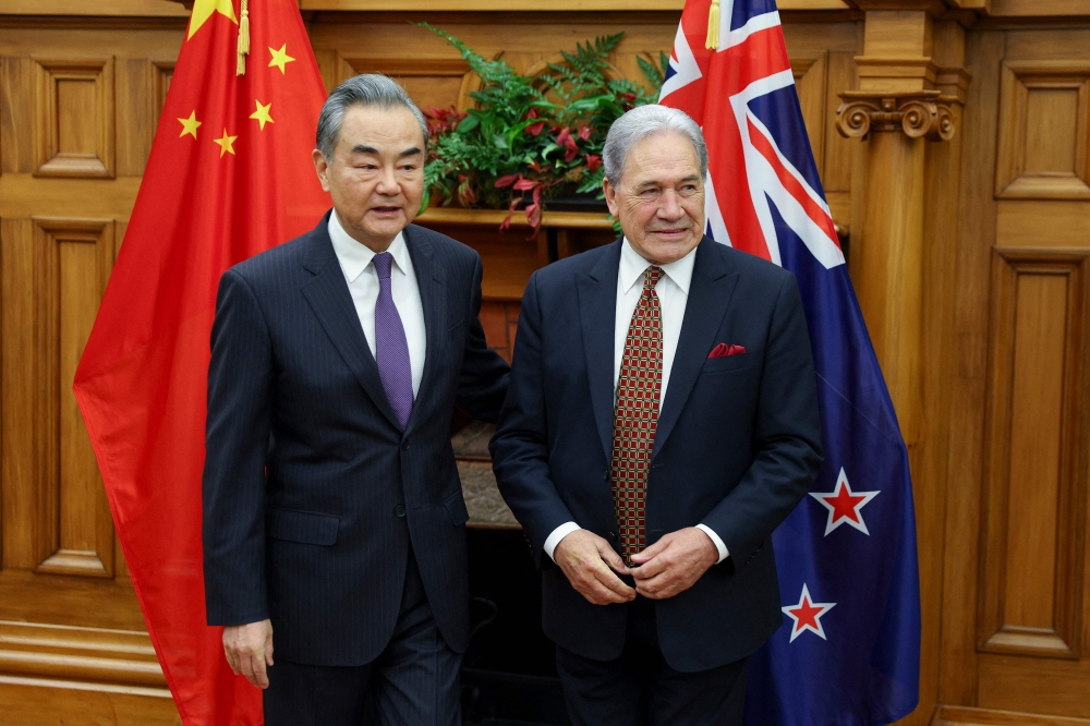 Chinese Foreign Minister Wang Yi with New Zealand Foreign Affairs Minister Winston Peters. — AFP pic