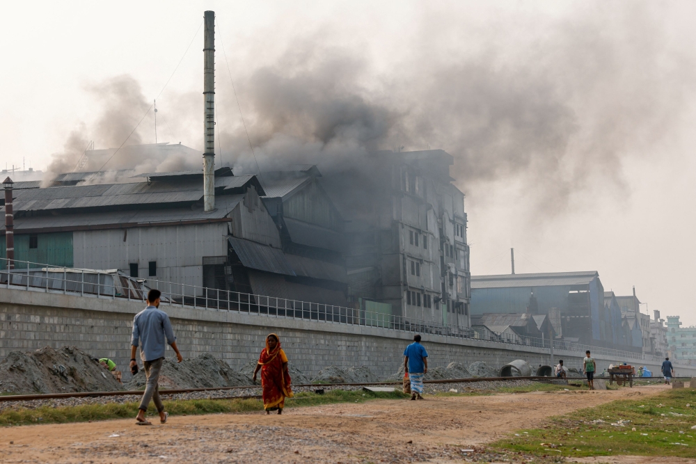 An industrial area at the Shyampur area of Dhaka, Bangladesh where smoke rises from re-rolling factories. — Reuters pic