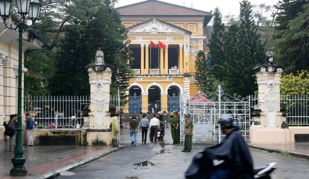A man rides a motorcycle past the People’s Court in Ho Chi Minh city January 20, 2010. — Reuters pic