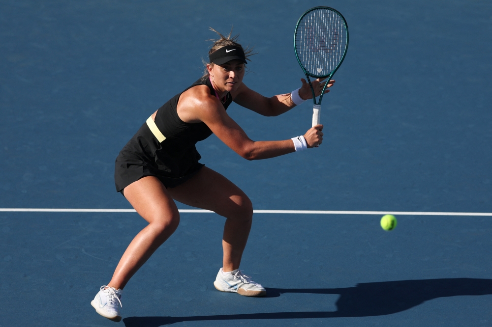 Paula Badosa of Spain returns a shot to Simona Halep of Romania during her women's singles match during the Miami Open at Hard Rock Stadium in Miami Gardens, Florida March 19, 2024. — Picture by Megan Briggs/Getty Images via AFP 