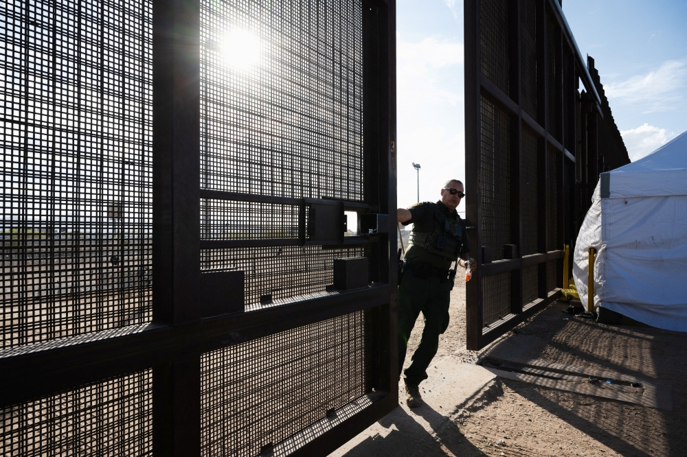 The US Supreme Court yesterday let a Republican-backed Texas law take effect that allows state law enforcement authorities to arrest people suspected of illegally crossing the US-Mexico border, rejecting a bid to block it by President Joe Biden’s administration. — Reuters pic