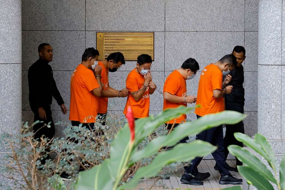 Ten civil servants, including a woman, have been remanded for four days, starting today, on suspicion of accepting over RM3 million in bribes from a tobacco, cigarette and alcohol smuggling syndicate. — Bernama pic