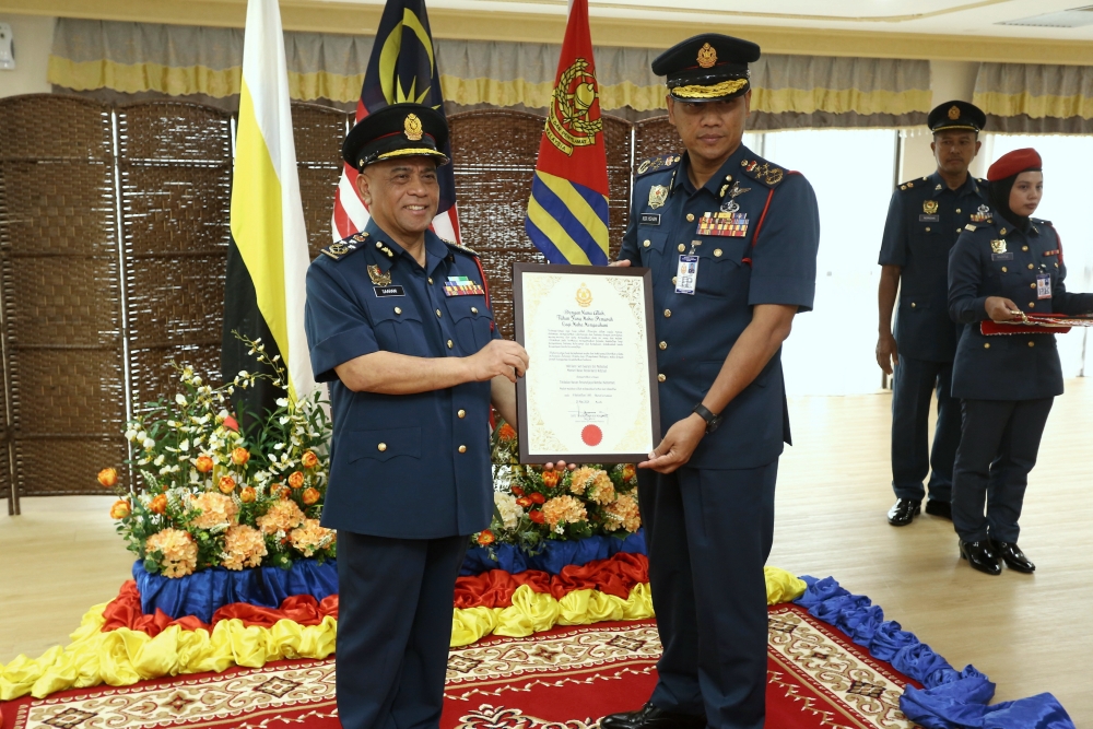 Perak Menteri Besar Datuk Seri Saarani Mohamad (left) receives his rank at the (Honorary) Award Ceremony of the Fire and Rescue Department, which was presented by JBPM director-general Datuk Nor Hisham Mohammad in Ipoh March 20, 2024. — Bernama pic