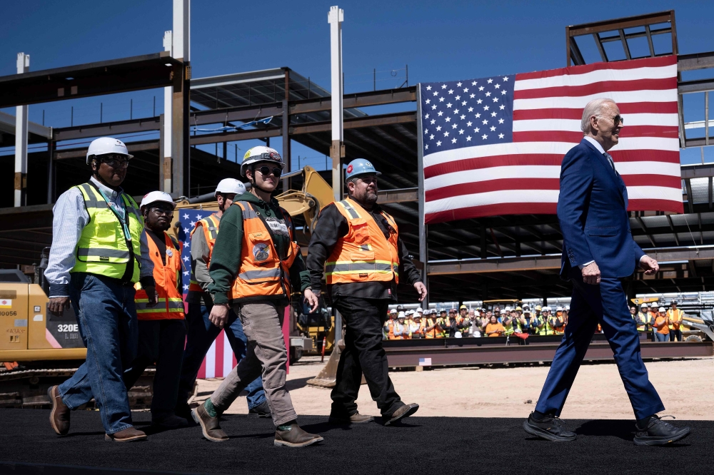 US President Joe Biden arrives with union members to speak after touring Intel's Ocotillo Campus in Chandler, Arizona, on March 20, 2024. — AFP pic
