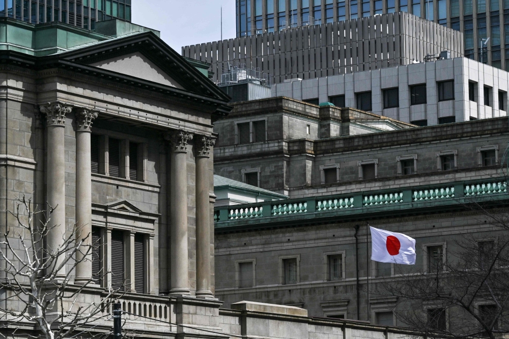 The Bank of Japan is expected to hike the interest rate in either July or October, though an October hike is considered more likely. — AFP pic