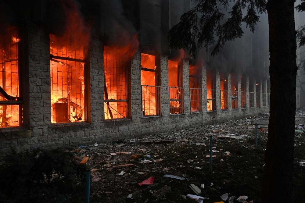 A Russian missile slammed into an eight-storey building and a factory in Kharkiv, which lies 30 kilometres from the Russian border. — AFP pic