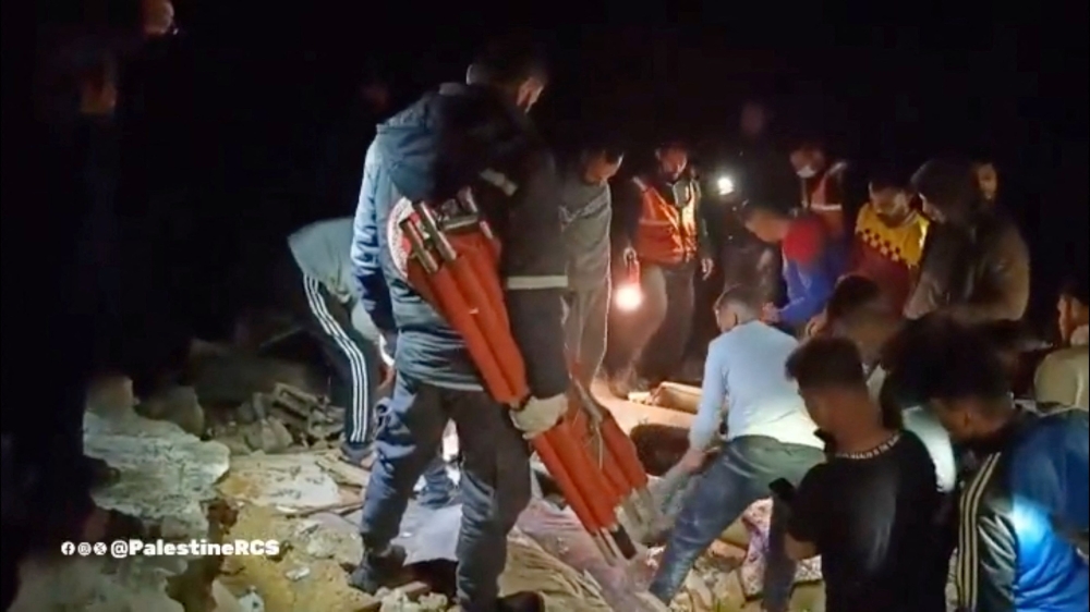 Rescuers work to retrieve casualties from under the rubble following what the Palestine Red Crescent Society says is an Israeli strike, amid the ongoing conflict between Israel and Palestinian Islamist group Hamas, at a location given as the central Gaza Strip, in this screengrab from a handout video released on March 18, 2024. — Palestine Red Crescent Society handout via Reuters