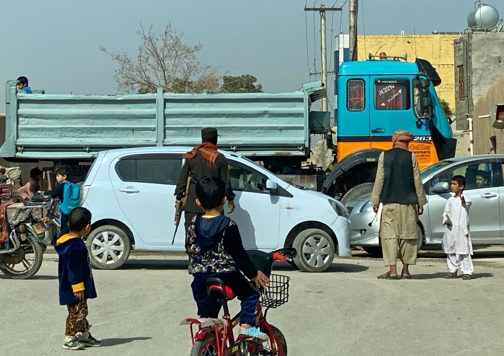 An Afghan security personnel checks a vehicle near the site of a suicide bomb attack in Kandahar on March 21, 2024. A suicide bombing killed three people and wounded 12 others on March 21 in the Afghan city of Kandahar, a provincial official said, the heartland of the Taliban authorities that rule the country. — AFP pic