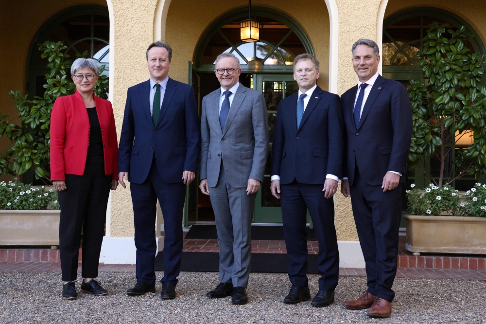 Australian Prime Minister Anthony Albanese (centre) poses with (from left) Australian Foreign Minister Penny Wong, the Britain Foreign Secretary David Cameron, British Defence Minister Grant Shapps and Australian Deputy Prime Minister and Defence Minister Richard Marles outside the Lodge ahead of the annual Australia-Britain Ministerial Consultations (Aukmin) in Canberra on March 21, 2024. — AFP pic