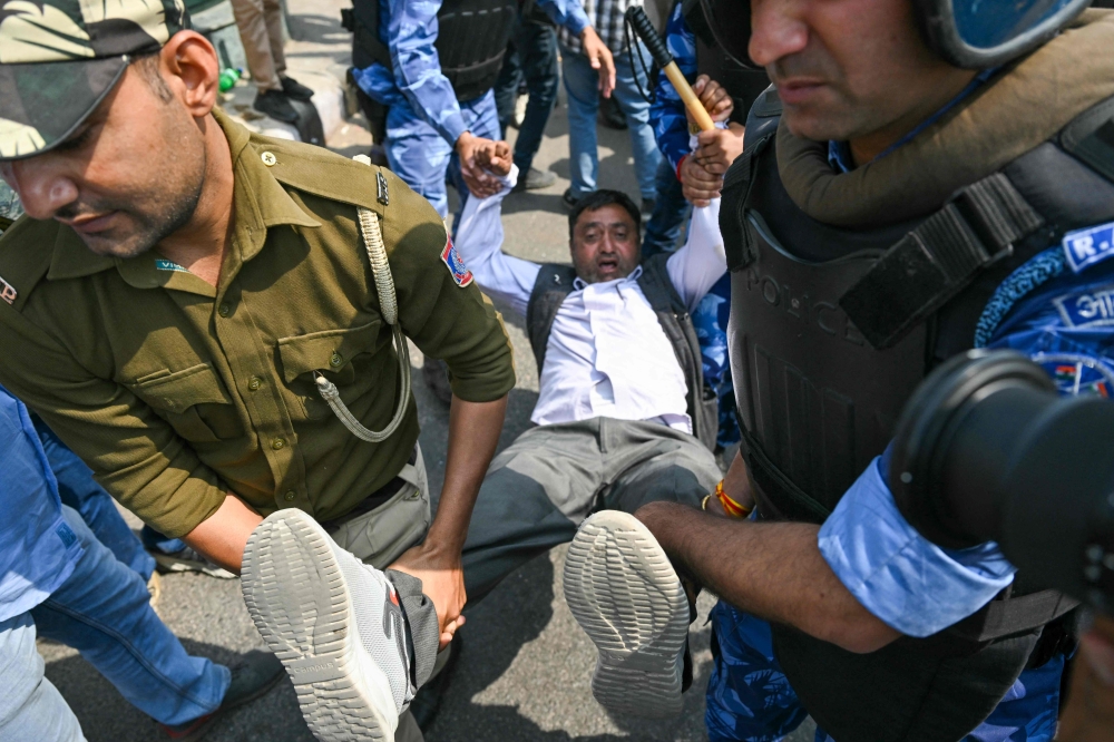 Police detain supporters of Aam Aadmi Party (AAP) at a protest in New Delhi on March 22, 2024. — AFP pic 