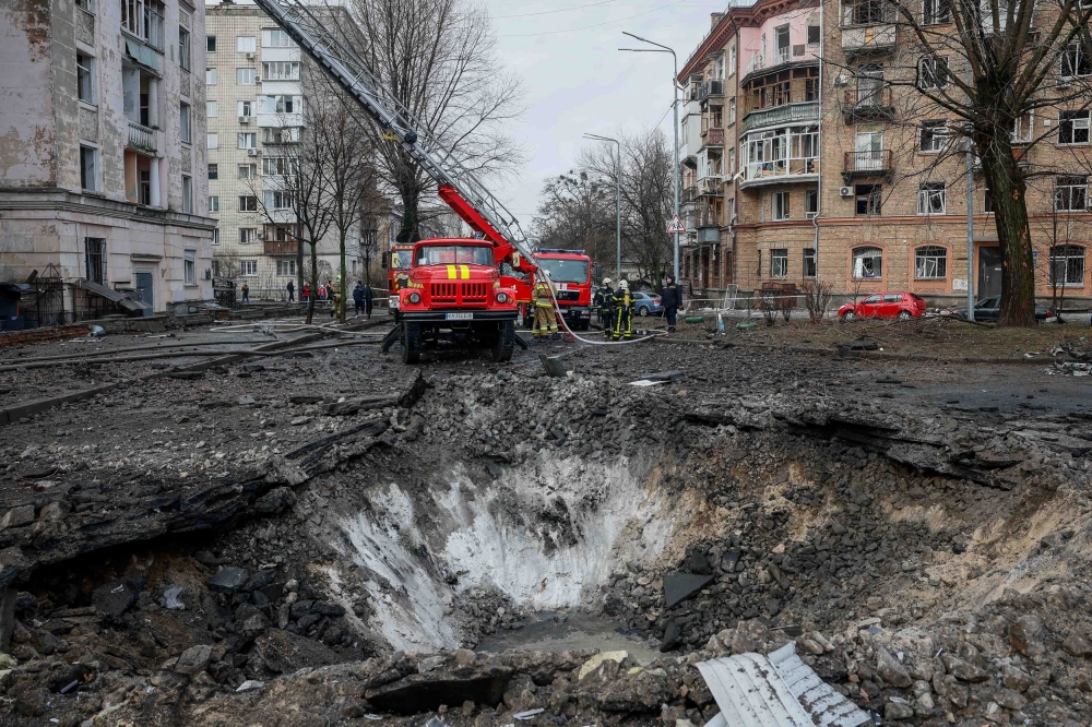 Rescuers work at a site of a building damaged during a Russian missile strike, amid Russia's attack on Ukraine, in Kyiv March 21, 2024. — Reuters pic  