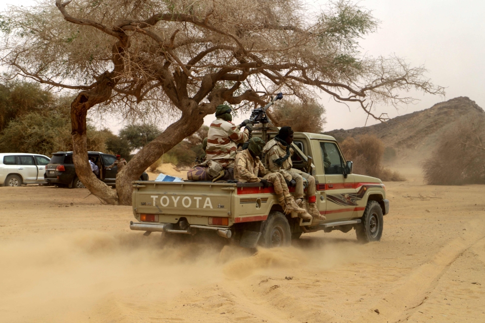 Niger soldiers patrol in the desert of Iferouane on February 12, 2020 to protect tourists and dignitaries during the Air Festival. Twenty-three Nigerien soldiers were killed in a ‘terrorist’ ambush in western Niger during an offensive near the border with Burkina Faso, the defence ministry said. — AFP pic 