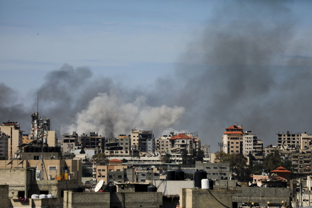Smoke rises during an Israeli raid at Al Shifa hospital and the area around it, amid the ongoing conflict between Israel and the Palestinian Islamist group Hamas, in Gaza City, March 21, 2024. — Reuters pic