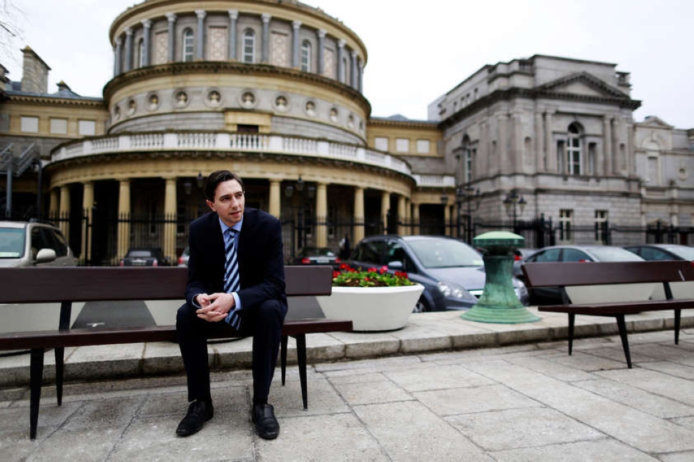 File photo of Ireland's Minister of State for Finance Simon Harris in front of Leinster House, where the Irish parliament is located, in Dublin March 5, 2015. - Reuters pic