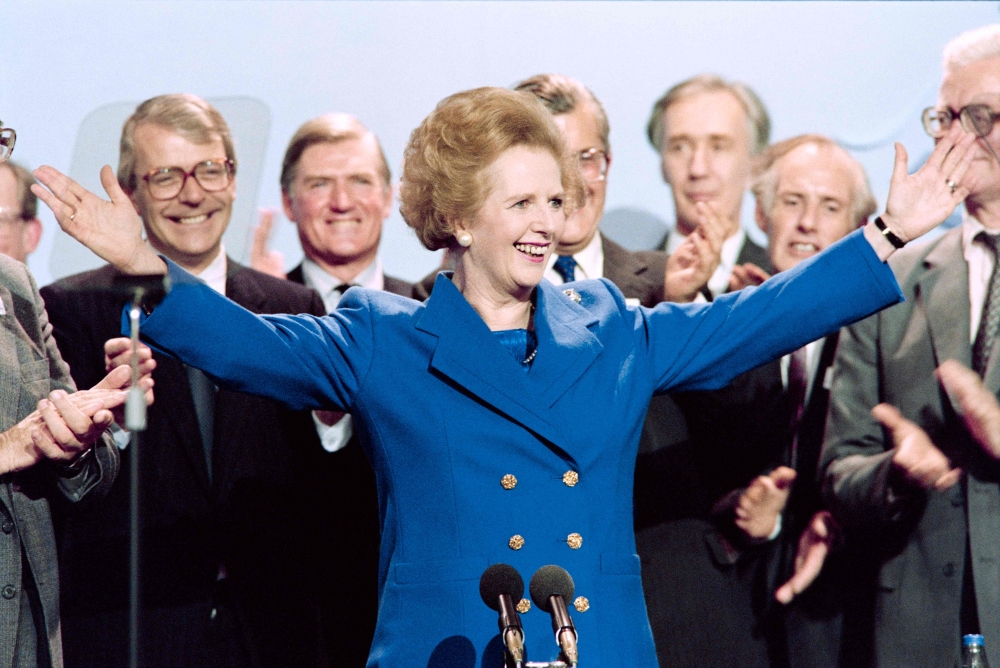 File photo of British Prime Minister Margaret Thatcher acknowledging applauds on October 13, 1989 at the end of the Conservative Party conference in Blackpool. — AFP pic