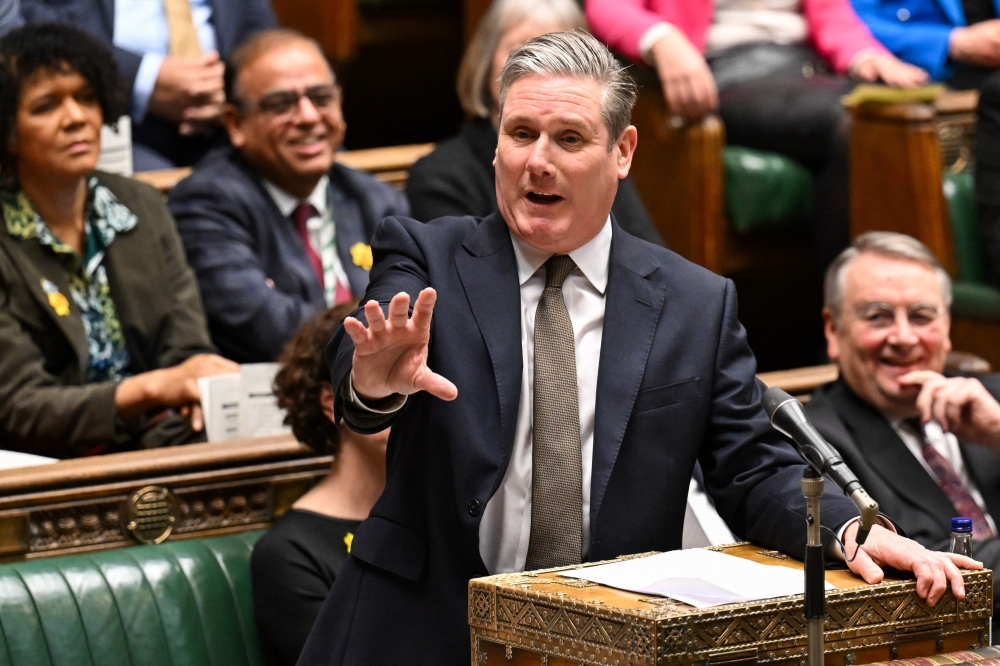 A handout photograph released by the UK Parliament shows Britain’s main opposition Labour Party leader Keir Starmer speaking during the weekly session of Prime Minister’s Questions (PMQs) in the House of Commons, in central London, on March 20, 2024. — AFP pic