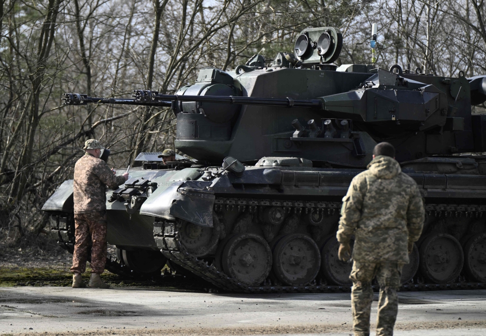 File photo of Ukrainian servicemen, crew members of a German-made self-propelled anti-aircraft (SPAAG), better known as the Flakpanzer Gepard, preparing for a combat duty in Kyiv region, on March 21, 2024, amid the Russian invasion of Ukraine. — AFP pic