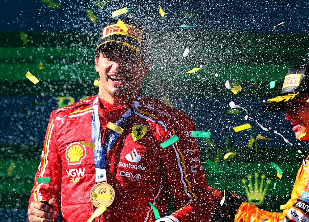 Ferrari's Carlos Sainz Jr. celebrates on the podium after winning the Australian Grand Prix at the Melbourne Grand Prix Circuit, Melbourne March 24, 2024. — Reuters pic