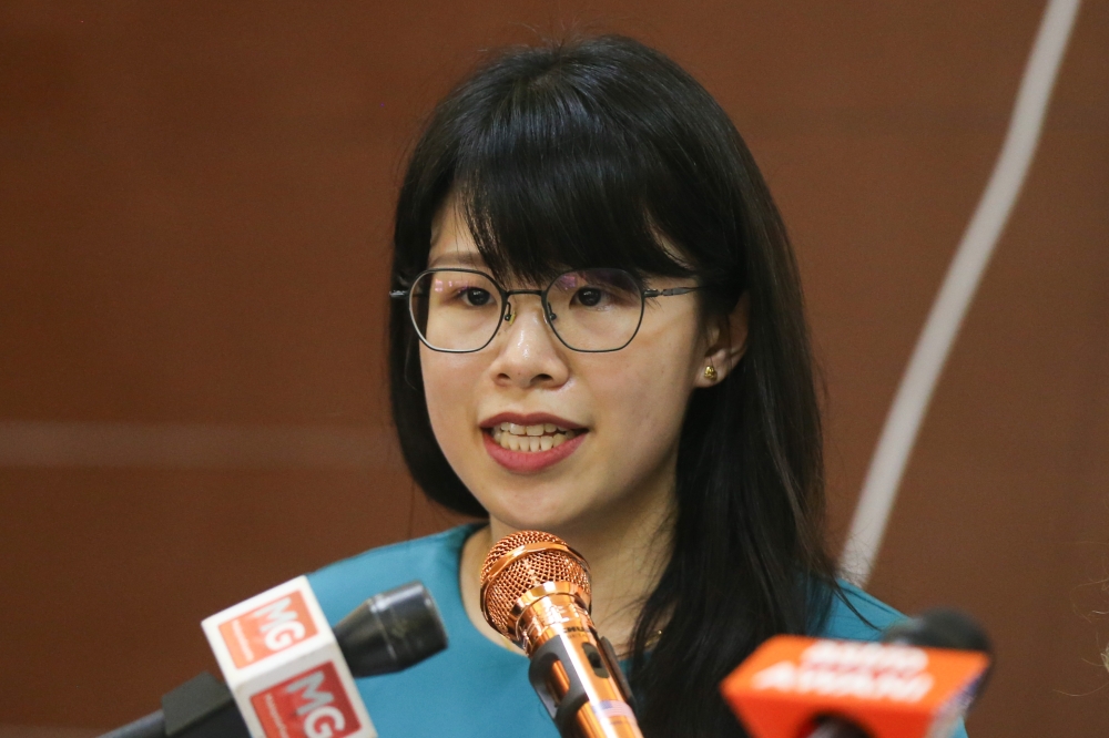 Jasmine Wong speaks during MCRA press conference on three remaining Citizenship Amendments at Chow Kit on March 24, 2024. — Picture by Miera Zulyana