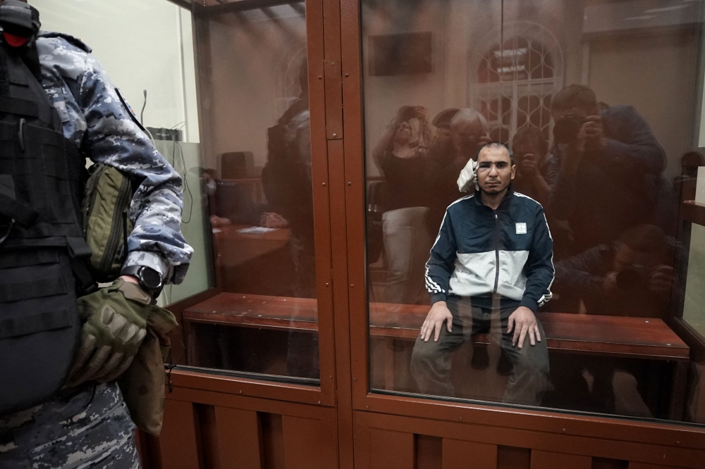 One of the four men accused of involvement in the Moscow concert hall attack that killed at least 137 people were charged with terrorism yesterday and ordered to be detained pending trial. — AFP pic