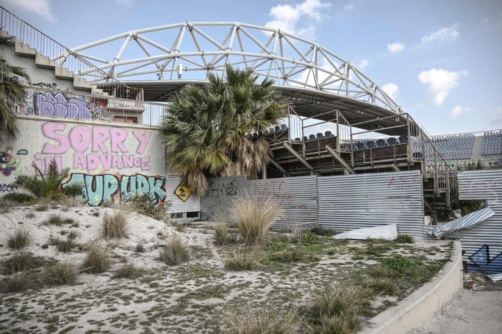 This photograph taken on February 19, 2024 shows the abandoned beach volleyball stadium at the Faliro Olympic coastal zone in Athens. — AFP pic