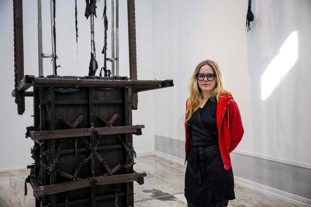 Swedish artist Ida Idaida poses next to her sculpture at the Museum of Art at the Museum of Art in Norrkoping, Sweden on March 12, 2024. — AFP pic