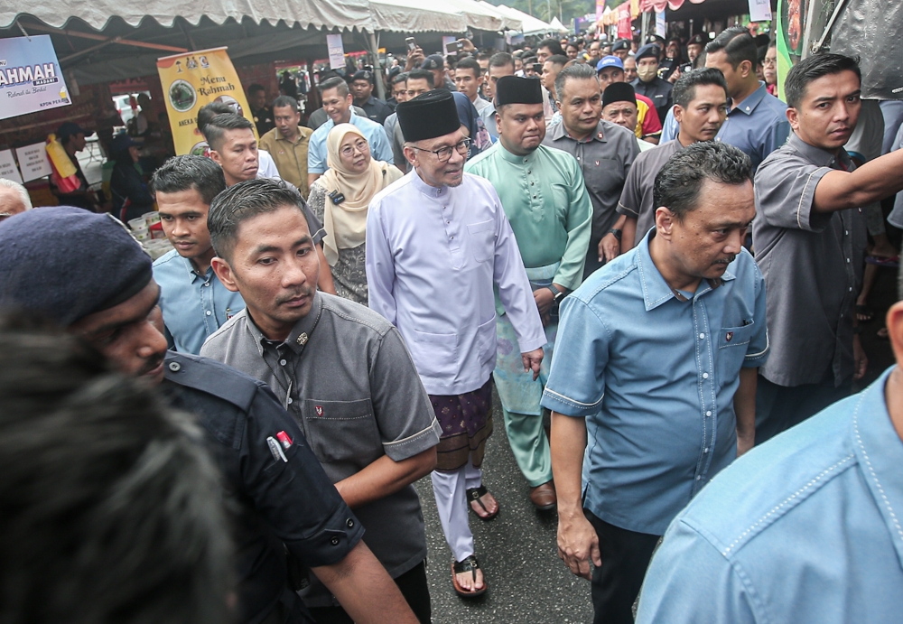 Prime Minister Datuk Seri Anwar Ibrahim during a walkabout session at Taman Perpaduan Ulu Kinta’s Ramadan bazaar in Ipoh, March 25, 2024. — Picture by Farhan Najib