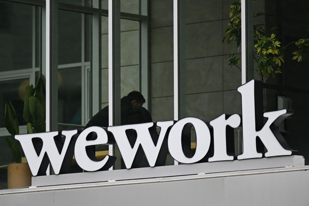 WeWork went into bankruptcy in November with its major creditors set to take control of the company. — AFP file pic