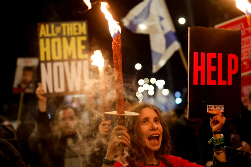Demonstrators attend a protest against Israeli Prime Minister Benjamin Netanyahu’s government and call for the release of hostages kidnapped during the October 7 attack. — Reuters pic