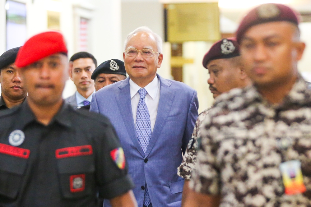 Former prime minister Datuk Seri Najib Razak at the Kuala Lumpur High Court, March 25, 2024. In his witness statement, former director of SRC International Sdn Bhd Datuk Shahrol Azral Ibrahim Halmi said he was powerless in making decisions for the company as Najib had absolute power to make all decisions pertaining to the directions, business, administration and operations of SRC International. — Picture by Miera Zulyana