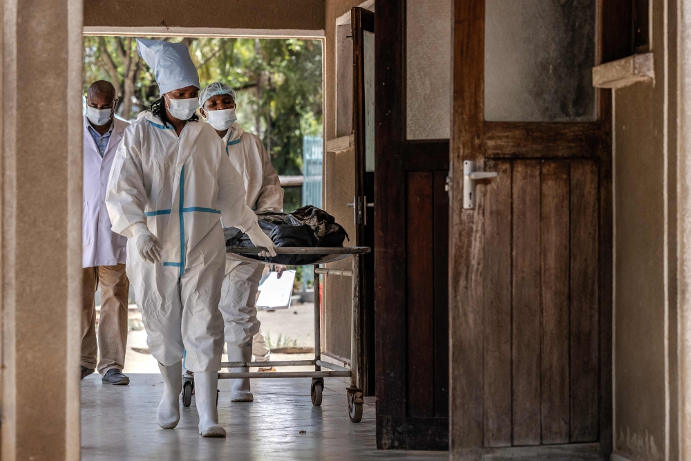 Families have had to endure a painful wait for the bodies of their loved-ones after the DNA profiling was delayed by lack of reagents and equipment. — AFP pic