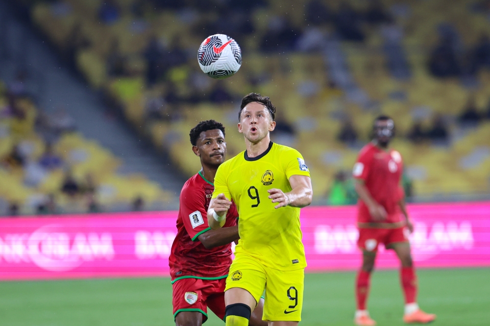 Harimau Malaya forward Darren Lok controls the ball during the match against Oman March 26, 2024. ― Bernama pic