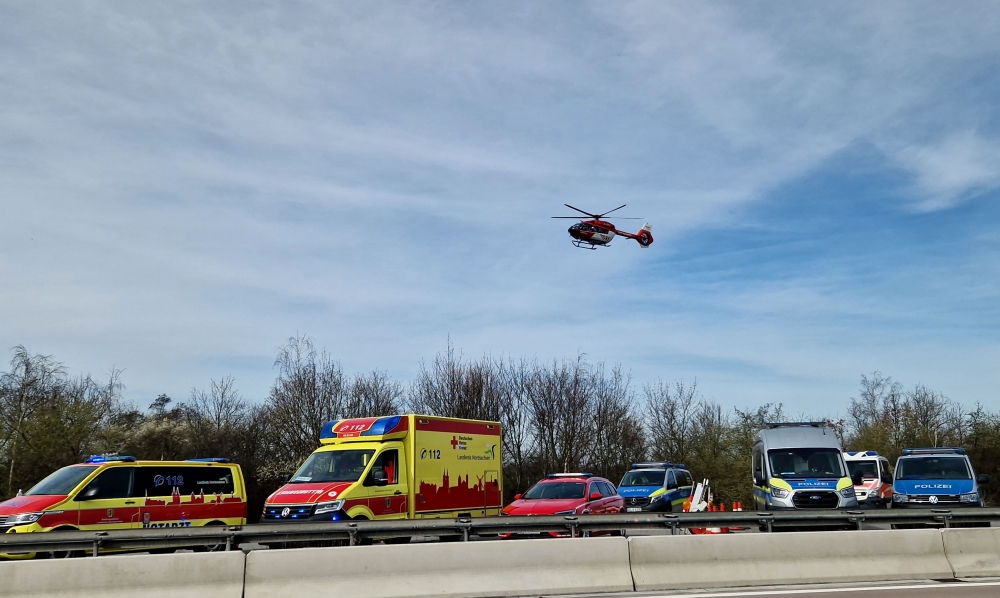 A helicopter flies over ambulance cars at the scene after several people were killed and more injured in a coach crash on the A9 motorway off Schkeuditz, near the eastern German city of Leipzig, Germany, March 27, 2024. — Reuters pic