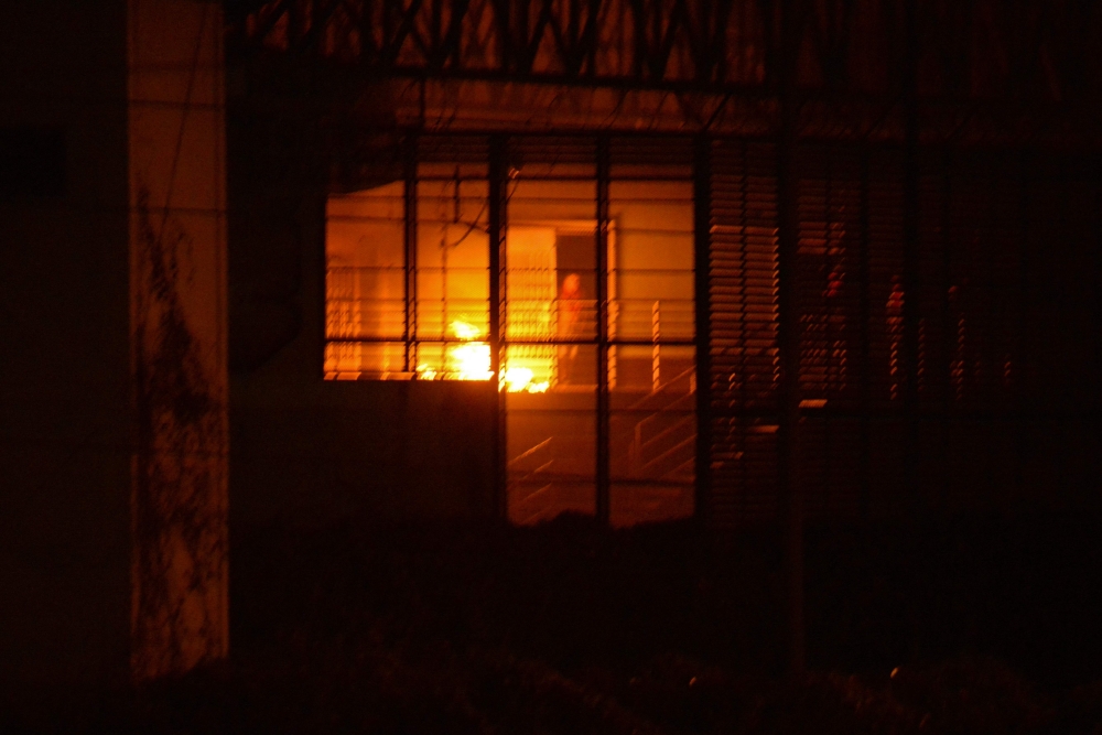 A fire is seen at the Guayas 4 block inside the Regional 8 prison complex after an 