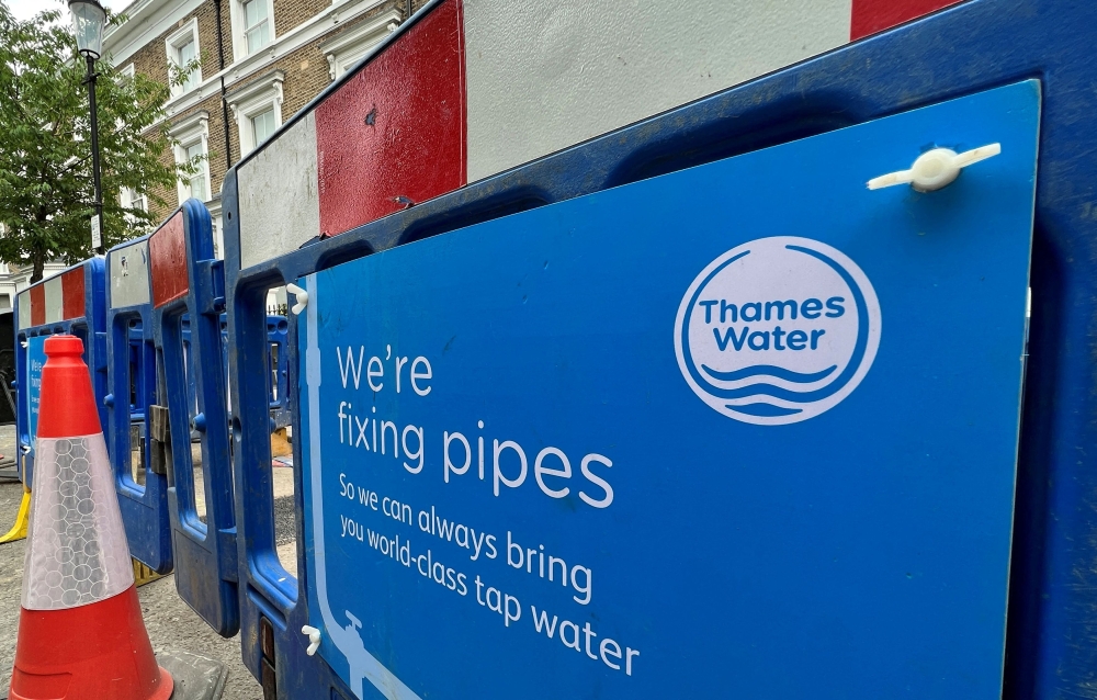 Signage is seen for British utility company Thames Water at a repair site in London June 28, 2023. — Reuters pic  