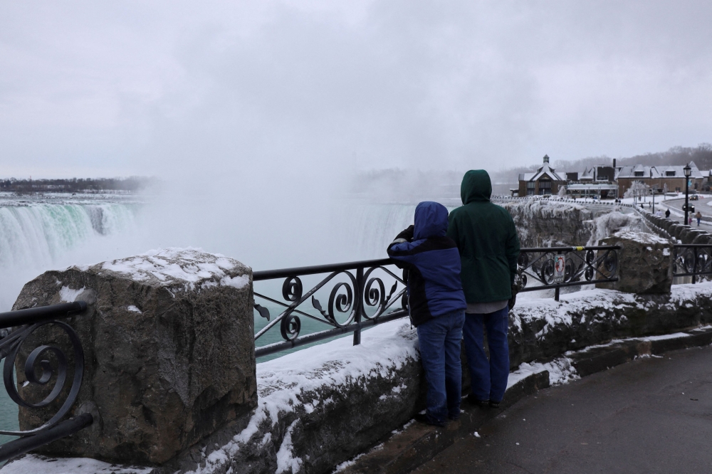 Tourists view mist rising from the Horseshoe Falls while visiting Niagara Falls, Ontario March 22, 2024.  — Reuters pic  