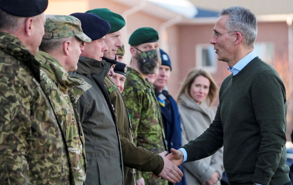 Nato Secretary General Jens Stoltenberg shakes hands with Commander of the Estonian Defence Forces lieutenant general Martin Herem during their visit to Nato enhanced Forward Presence battle group in Tapa military base, Estonia March 1, 2022. — Reuters file pic