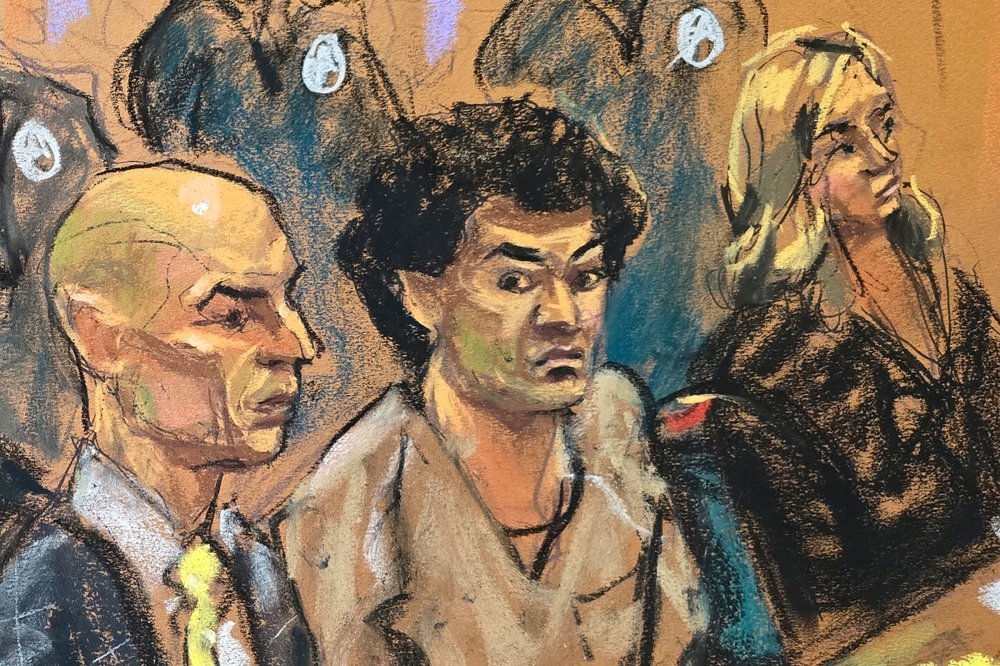 FTX cryptocurrency exchange founder Sam Bankman-Fried sits between his defence attorneys Marc Mukasey and Torrey Young during his sentencing hearing at the Federal Court in New York March 28, 2024 in this courtroom sketch. ― Reuters pic