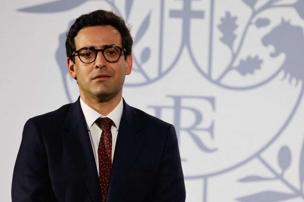 French Minister for Europe and Foreign Affairs Stephane Sejourne gestures while France's President Emmanuel Macron delivers a speech for the Communaute Francaise in Sao Paulo March 27, 2024. — AFP pic