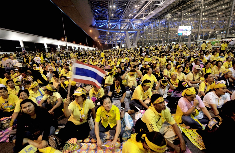This file picture taken on November 25, 2008 shows anti-government protesters shouting slogans during a protest at Suvarnabhumi international airport in Bangkok. A Thai court dismissed on March 29, 2024 terrorism charges against 67 anti-government protest leaders who occupied Bangkok's international airport in 2008, one of the defendants said. — AFP pic