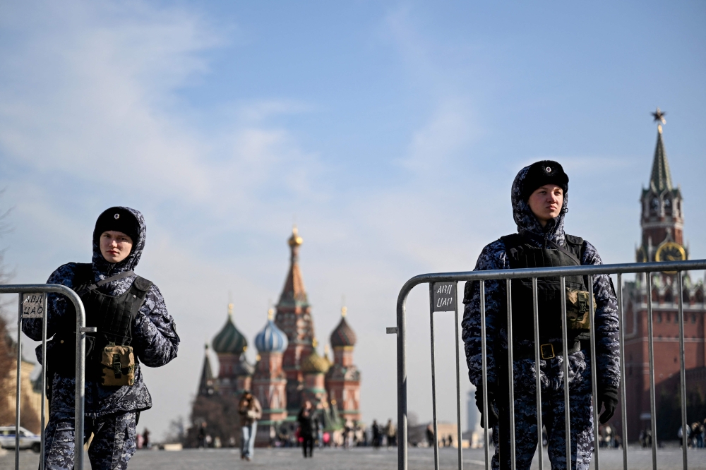 Russian law enforcement officers stand guard at the Red Square in Moscow on March 29, 2024, a week after a deadly attack by gunmen on a concert hall outside Moscow killed at least 143 people and wounded dozens more. — AFP pic