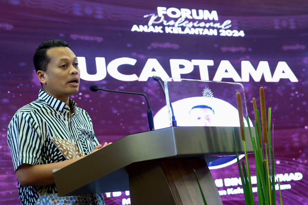 Natural Resources and Environmental Sustainability Minister Nik Nazmi Nik Ahmad delivers a speech during the 2024 Professional Forum for Kelantanese Youth in Kota Baru March 30, 2024. — Bernama pic
