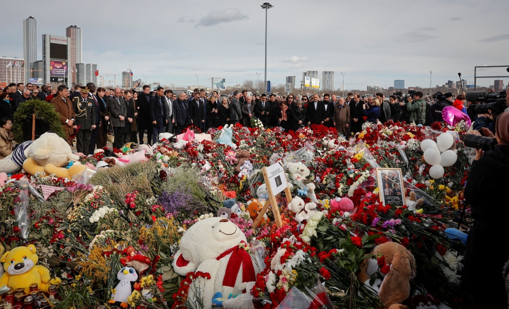 Ambassadors and staff of foreign diplomatic missions attend a flower laying ceremony in memory of the victims of the attack at Crocus City Hall concert venue, following an attack in Krasnogorsk, outside Moscow March 30, 2024. — Reuters pic  