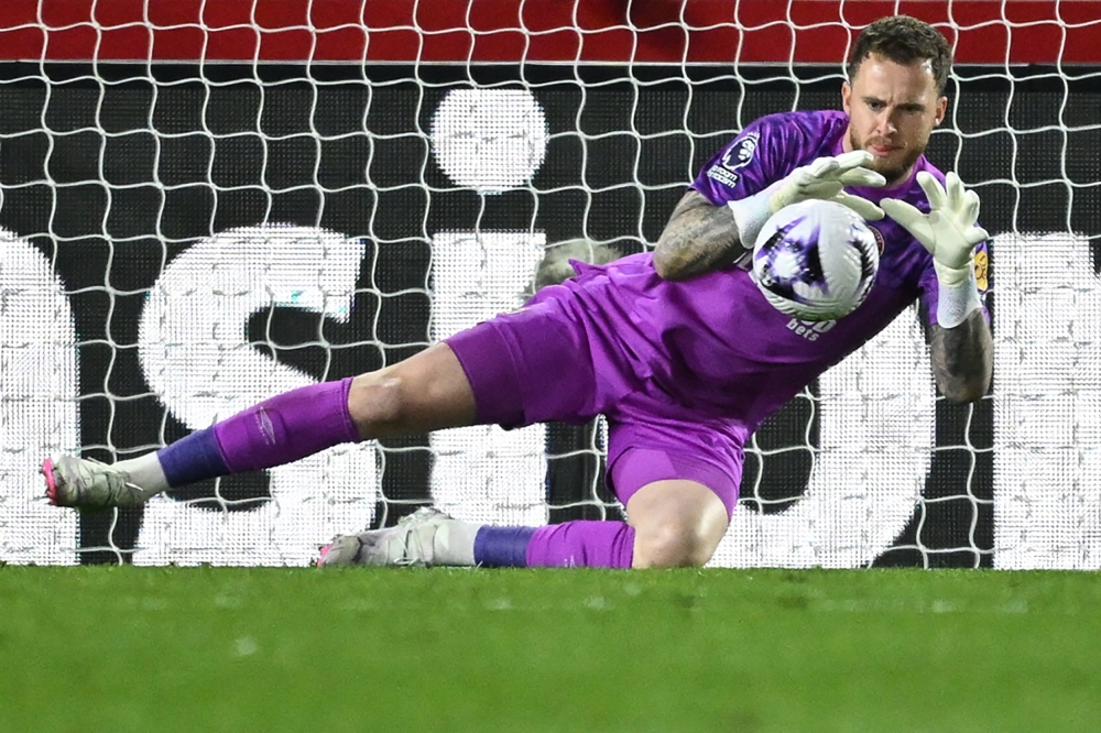 Brentford’s Dutch goalkeeper Mark Flekken jumps to save a shot during the English Premier League football match between Brentford and Manchester United at the Gtech Community Stadium in London on March 30, 2024. — AFP pic