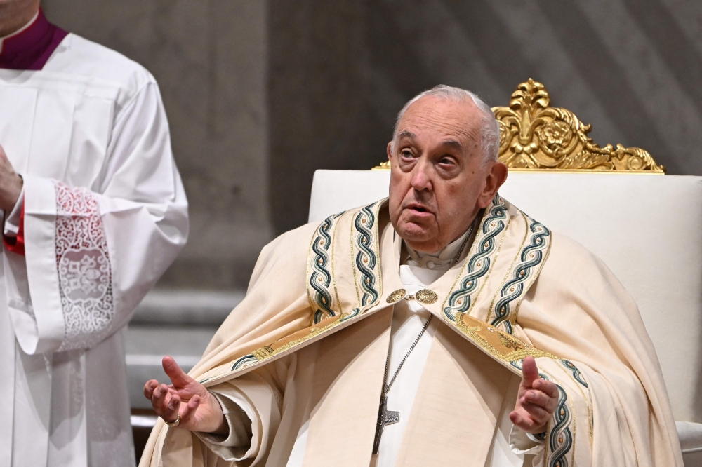 Pope Francis presides the Easter vigil as part of the Holy Week celebrations, at St Peter’s Basilica in the Vatican on March 30, 2024. — AFP pic