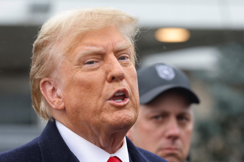 File photo of former President Donald Trump giving a brief statement after attending the wake for slain NYPD Officer Jonathan Diller at the Massapequa Funeral Home on March 28, 2024 in Massapequa, New York. — AFP pic